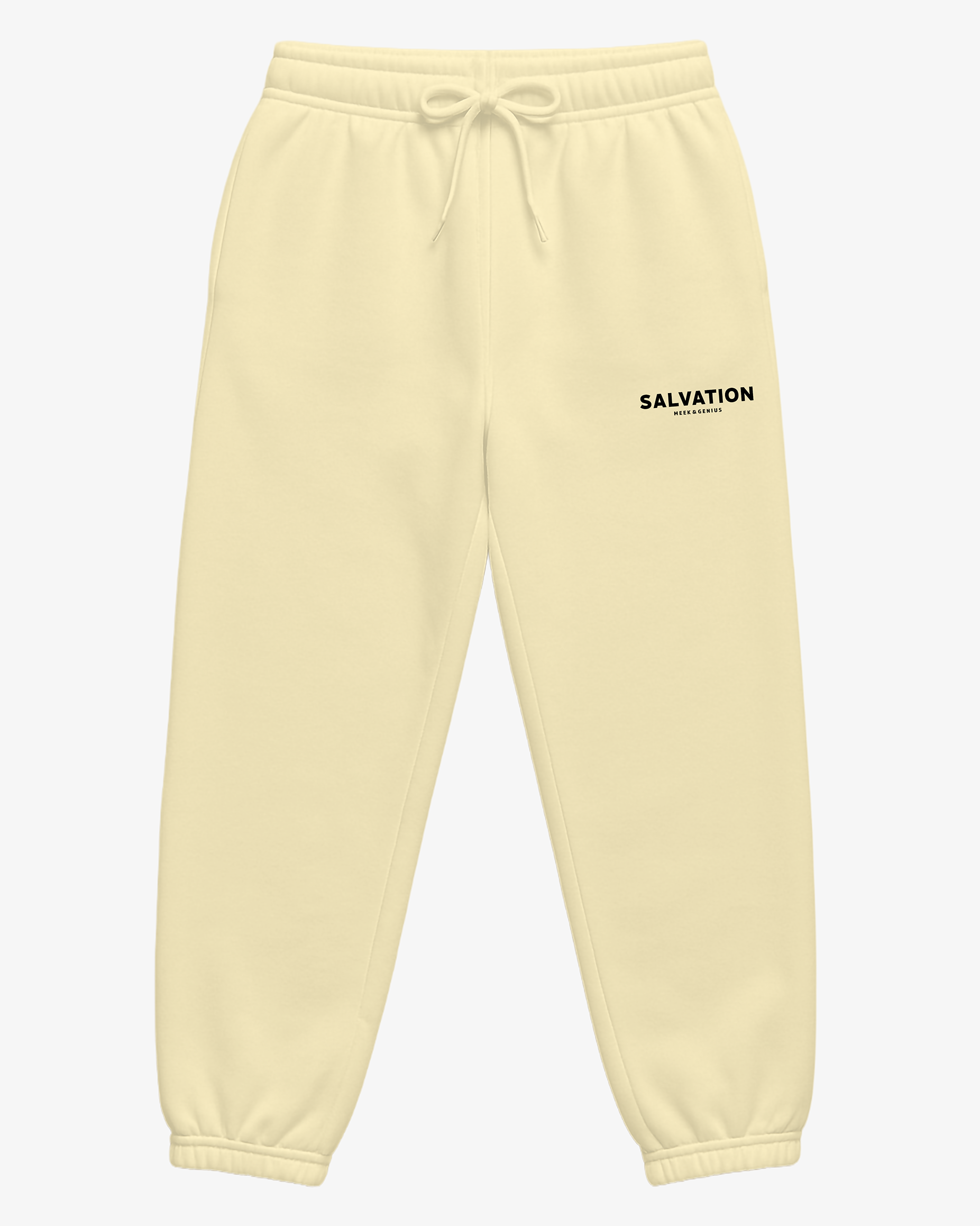 Faith-inspired track pants in light yellow featuring Salvation text logo, jersey lined pockets, and clean streetwear style.